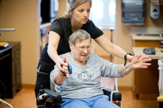 Lois Roberts does interactive metronome exercises as part of her Parkinson's disease-focused rehab therapy