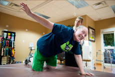 Jim Horrocks does Parkinson's Wellness Recovery exercises with help from physical therapist Christine Montes at Life Care Center of Elkhorn.