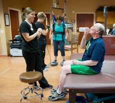 Jim Horrocks takes a break from his Parkinson's disease-focused rehab therapy with physical therapist Christine Montes